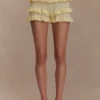 Amy Pointelle-stickade byxor med volanger – Lemon