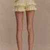 Amy Pointelle-stickade byxor med volanger – Lemon