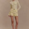 Amy Pointelle-stickade byxor med volanger – Lemon