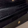 Jessica clutch i imiterat krokodilläder – svart Jessica clutch i imiterat krokodilläder – svart