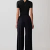 Junie kortärmad bodysuit med korsad överdel – svart Junie kortärmad bodysuit med korsad överdel – svart