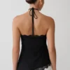 Theodosia asymmetrisk halterneck-top i spets – svart