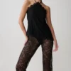 Theodosia asymmetrisk halterneck-top i spets – svart