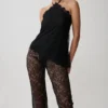 Theodosia asymmetrisk halterneck-top i spets – svart